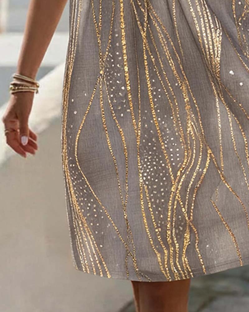 Brown V-neck print mini dress close-up detail