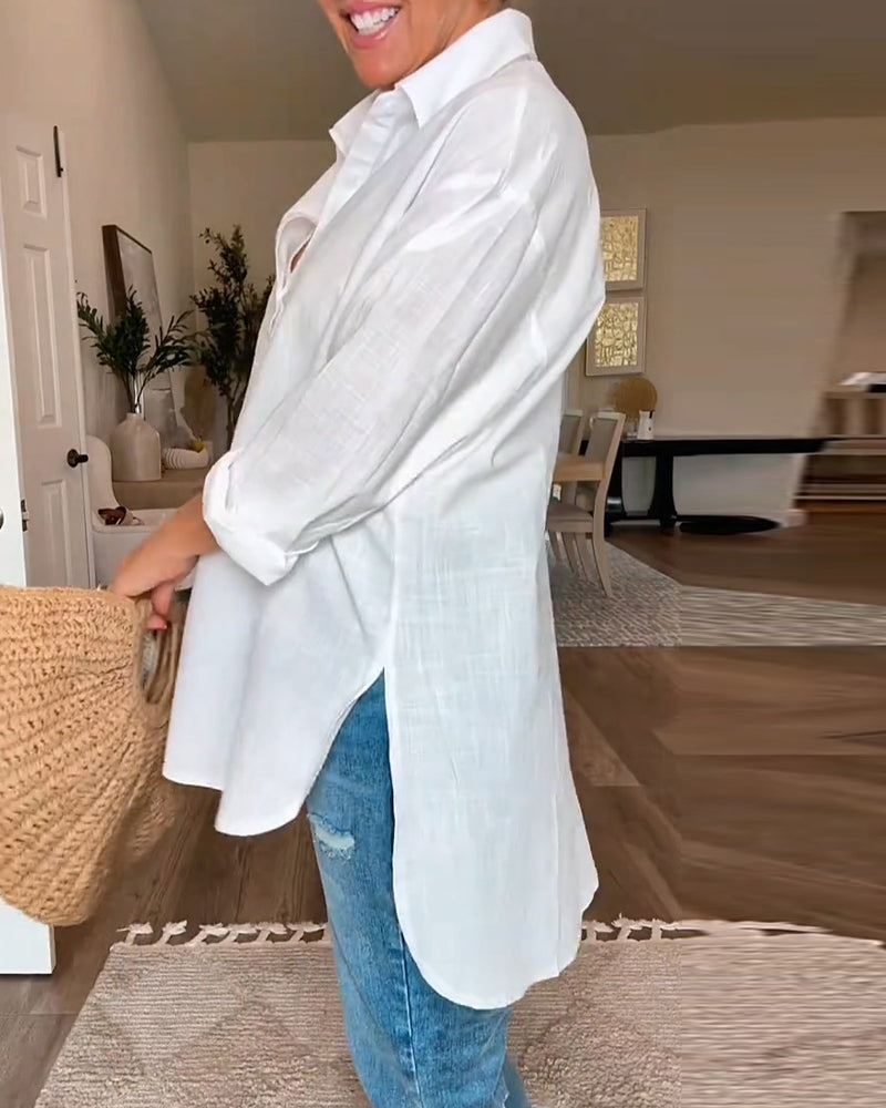 White loose blouse with button placket and V-neck, back view