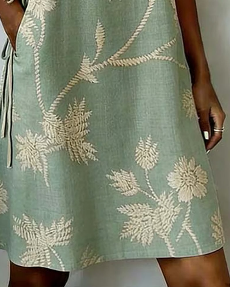 Green V-neck midi dress close-up button detail