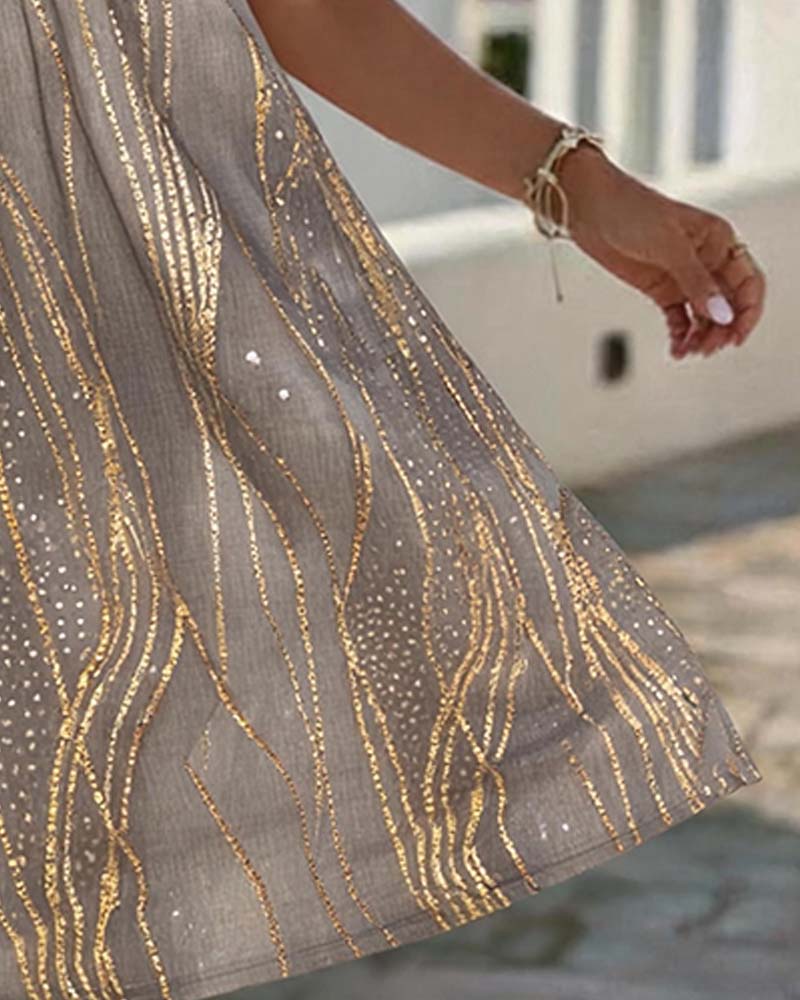 Brown sleeveless print mini dress, side view