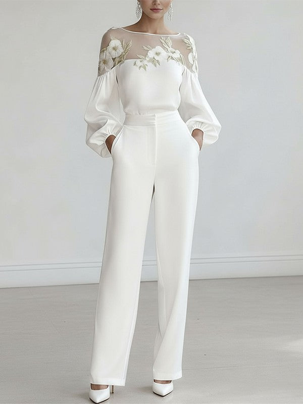 White floral applique mesh puff sleeve blouse, styled front view with tailored trousers