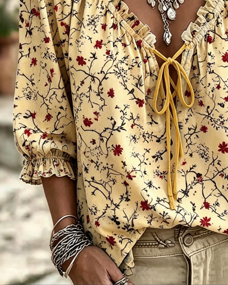 Yellow red flower print ruffle blouse, side view
