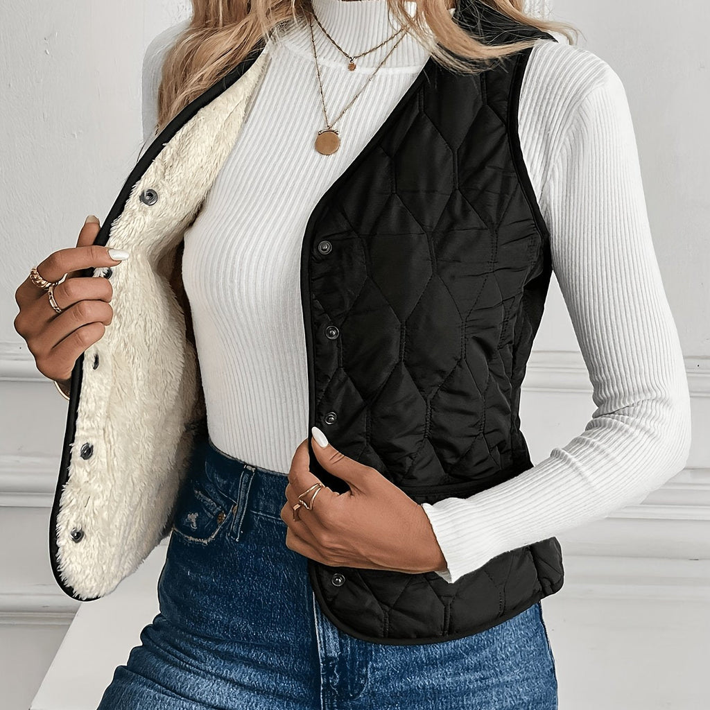 Black reversible quilted vest, front view