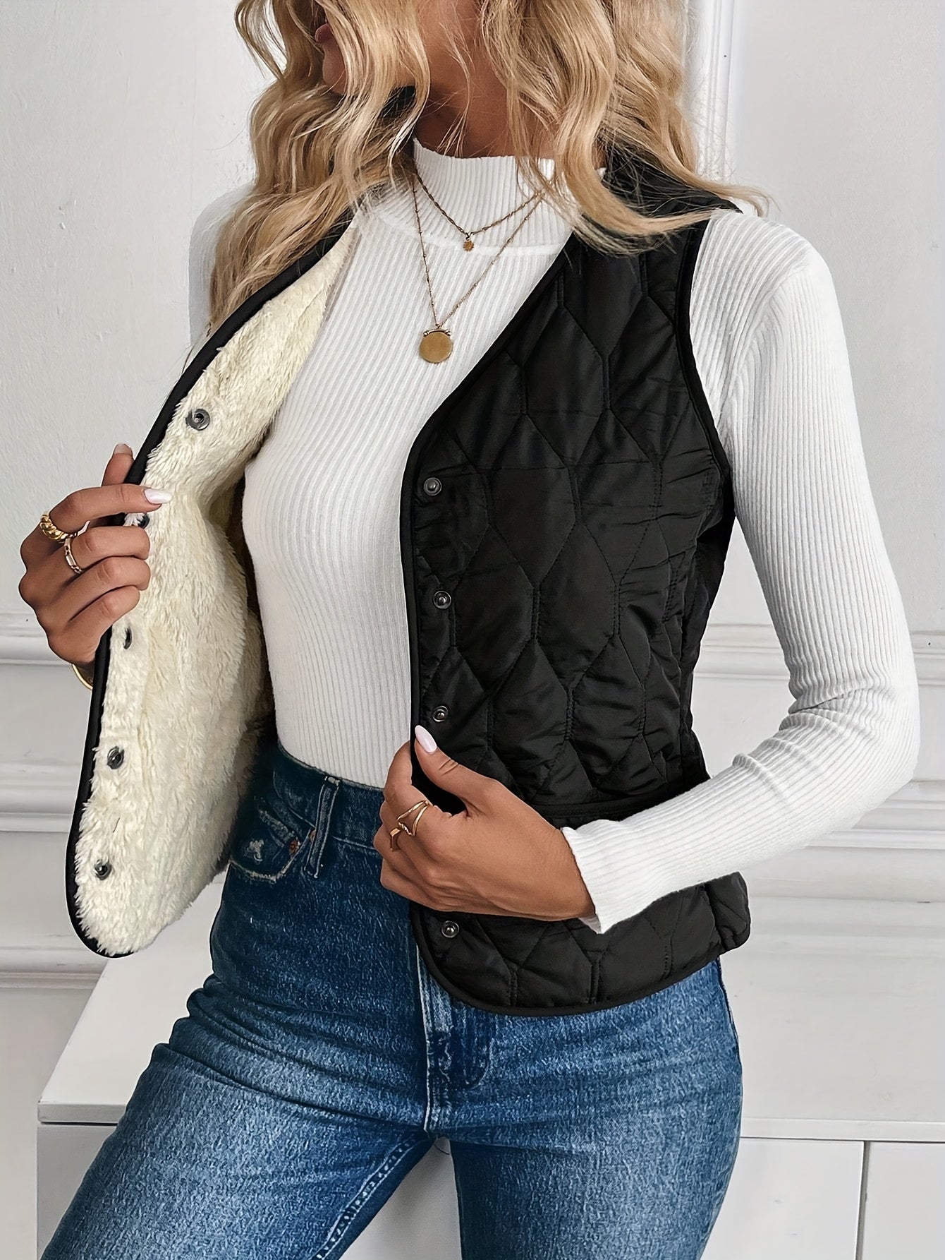 Black reversible quilted vest