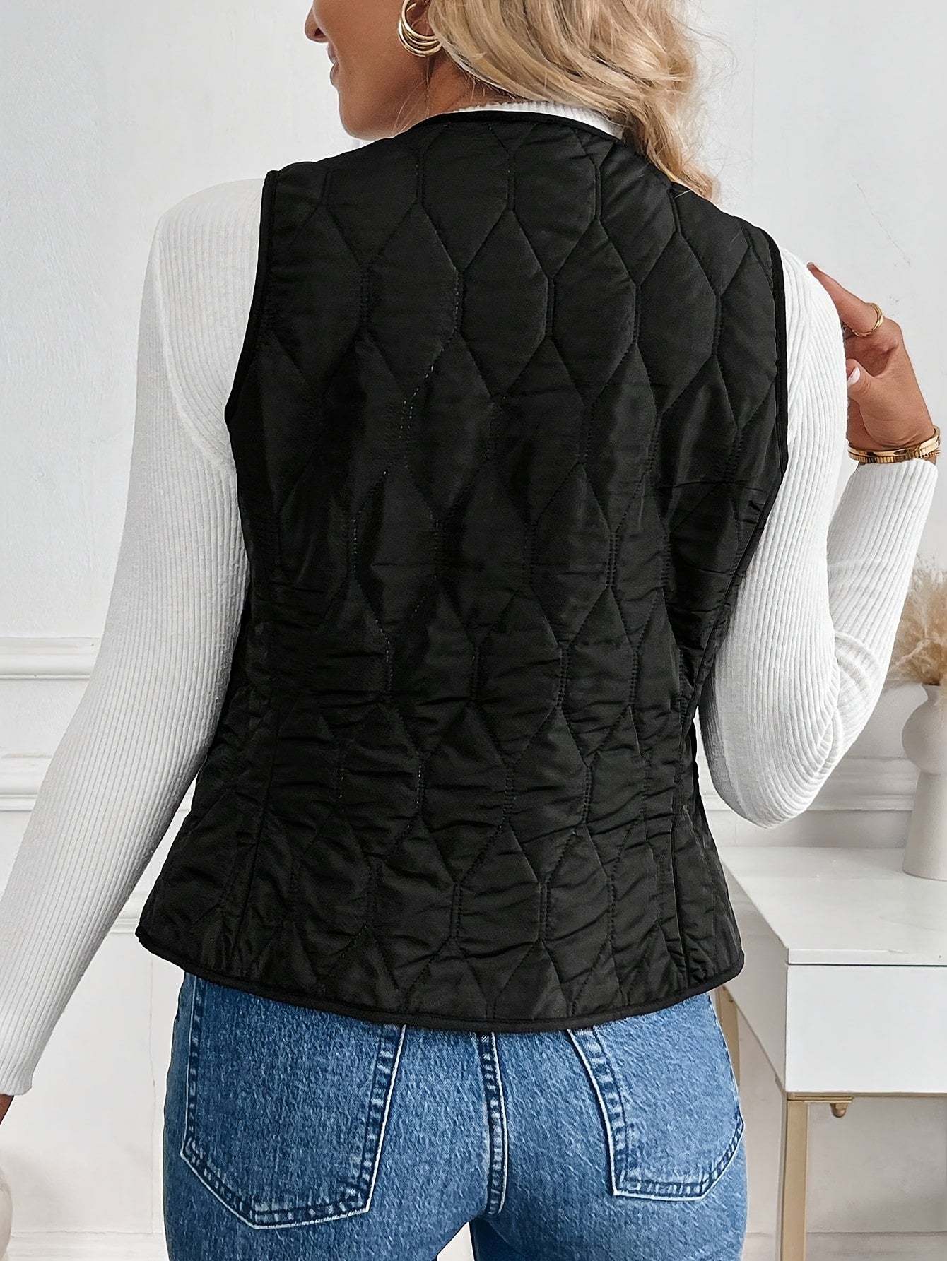 Black reversible quilted vest