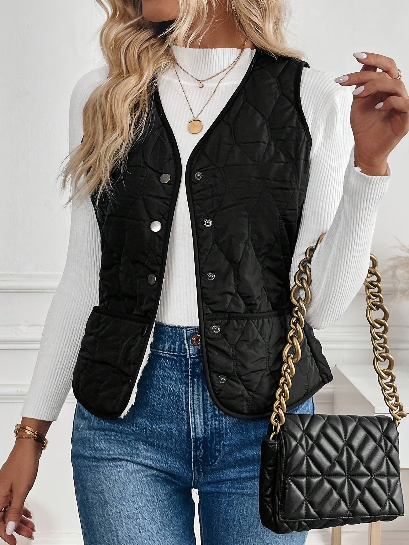 Black reversible quilted vest