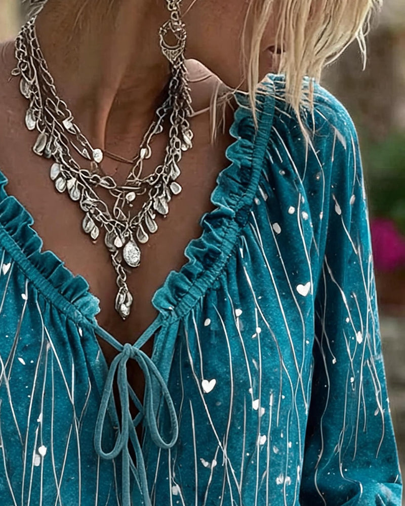 Blue ruffle sleeve heart print blouse, side view