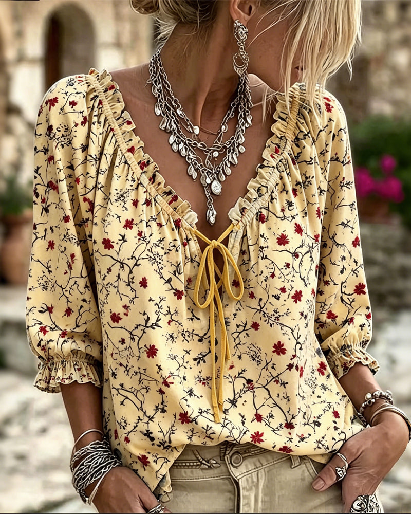 Yellow small red flower print V-neck ruffle tie blouse, front view
