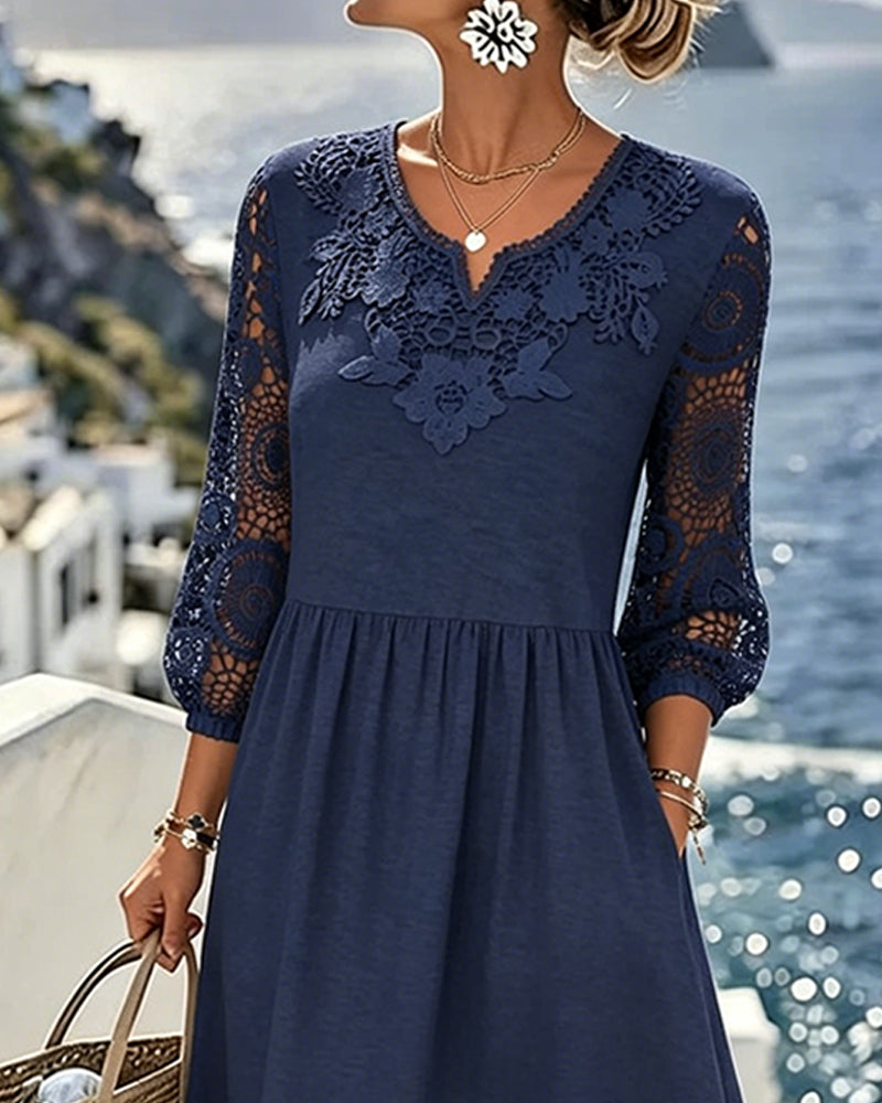 Navy blue A-line midi dress with lace sleeves, side view