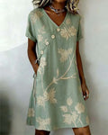Green diagonal button print V-neck midi dress, front view