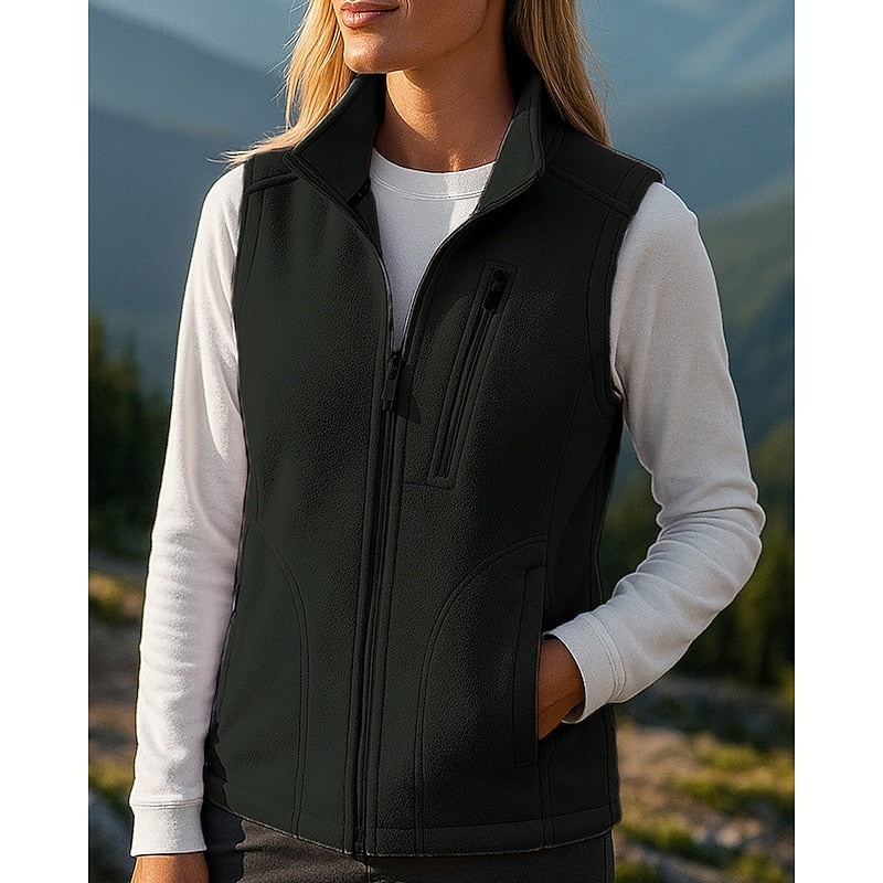 Black zip-up vest, close-up of stand collar and zip pockets