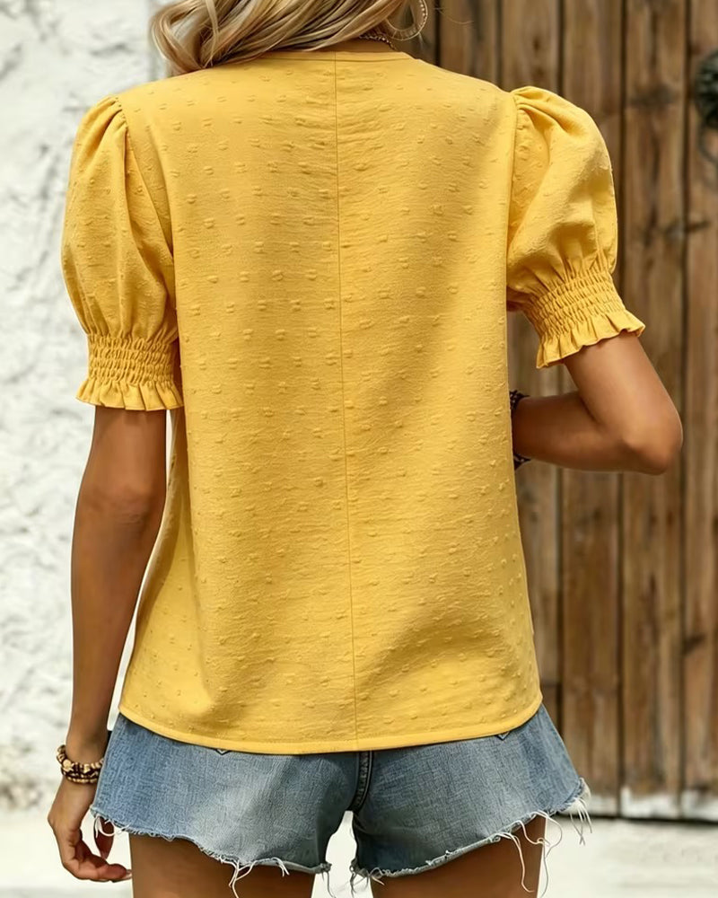 Yellow puff sleeve blouse with V-neck, back view