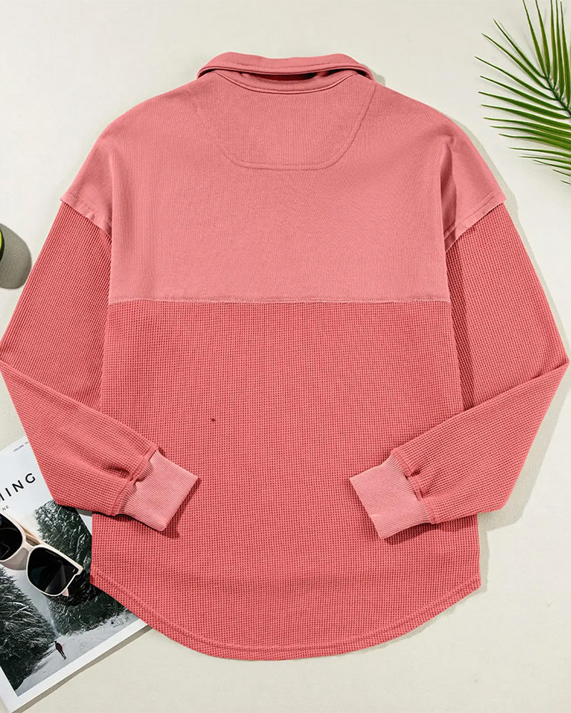 Gray waffle knit sweatshirt close-up detail view